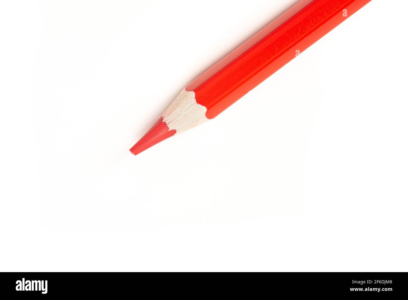 Close up of a red color pencil seen from a high angle on a white background Stock Photo