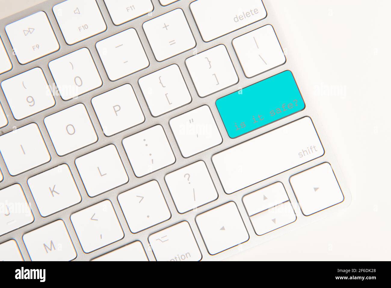 The return button on a computer keyboard colored blue, with the