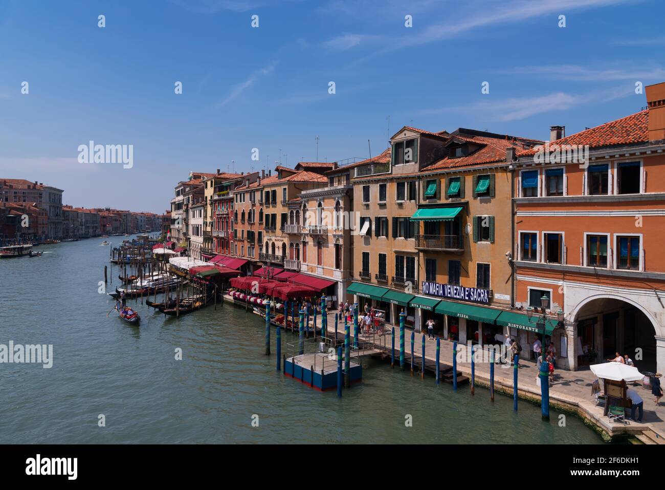 VENICE, ITALY, MAY 23, 2017: Magnificent daily view of Gondola with classical buildings along the famous Grand canal in Venice, Italy Stock Photo