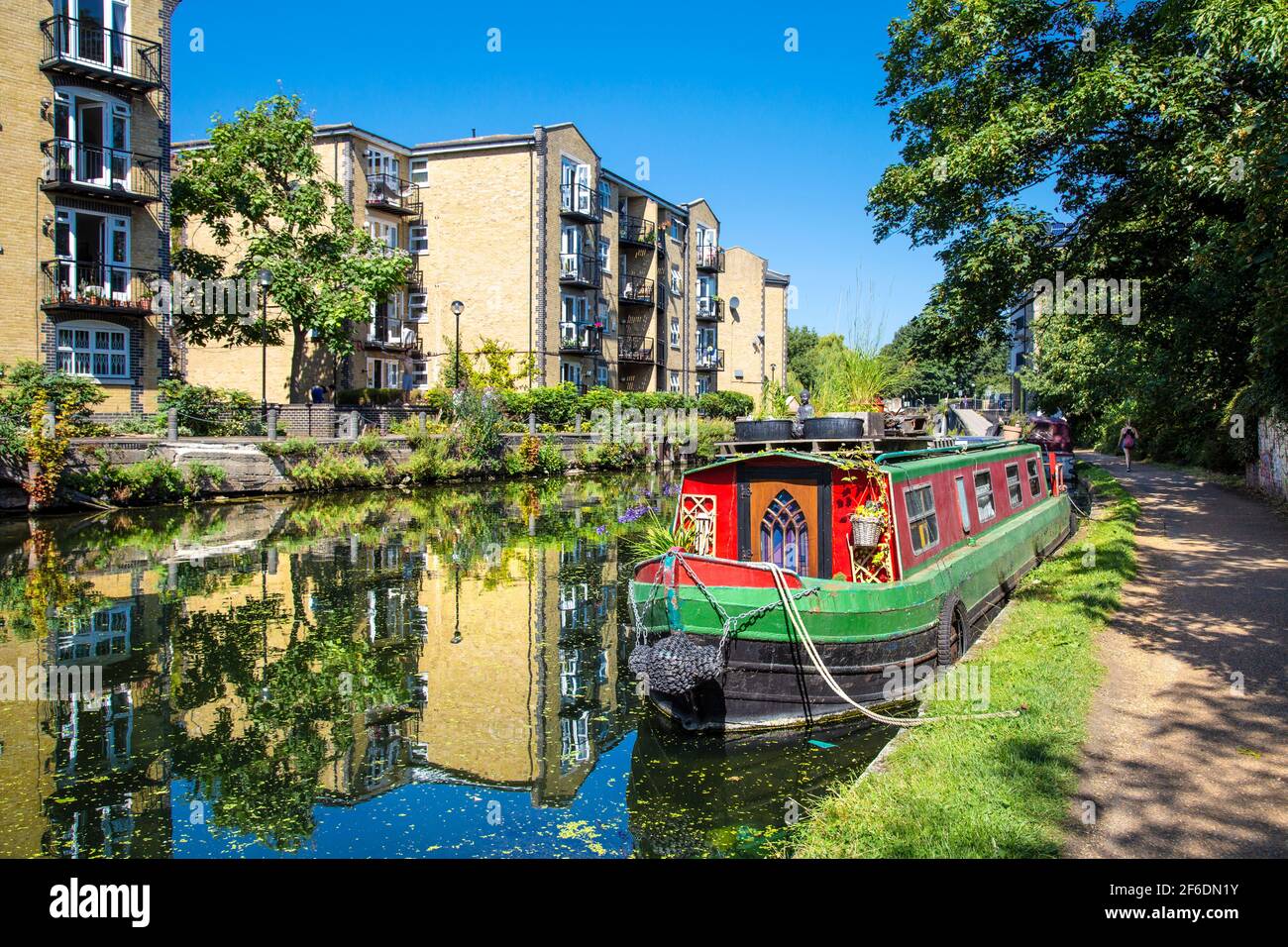 A colourful narrowboat mooring on the Regents Canal near Mile End and Victoria Park, London, UK Stock Photo