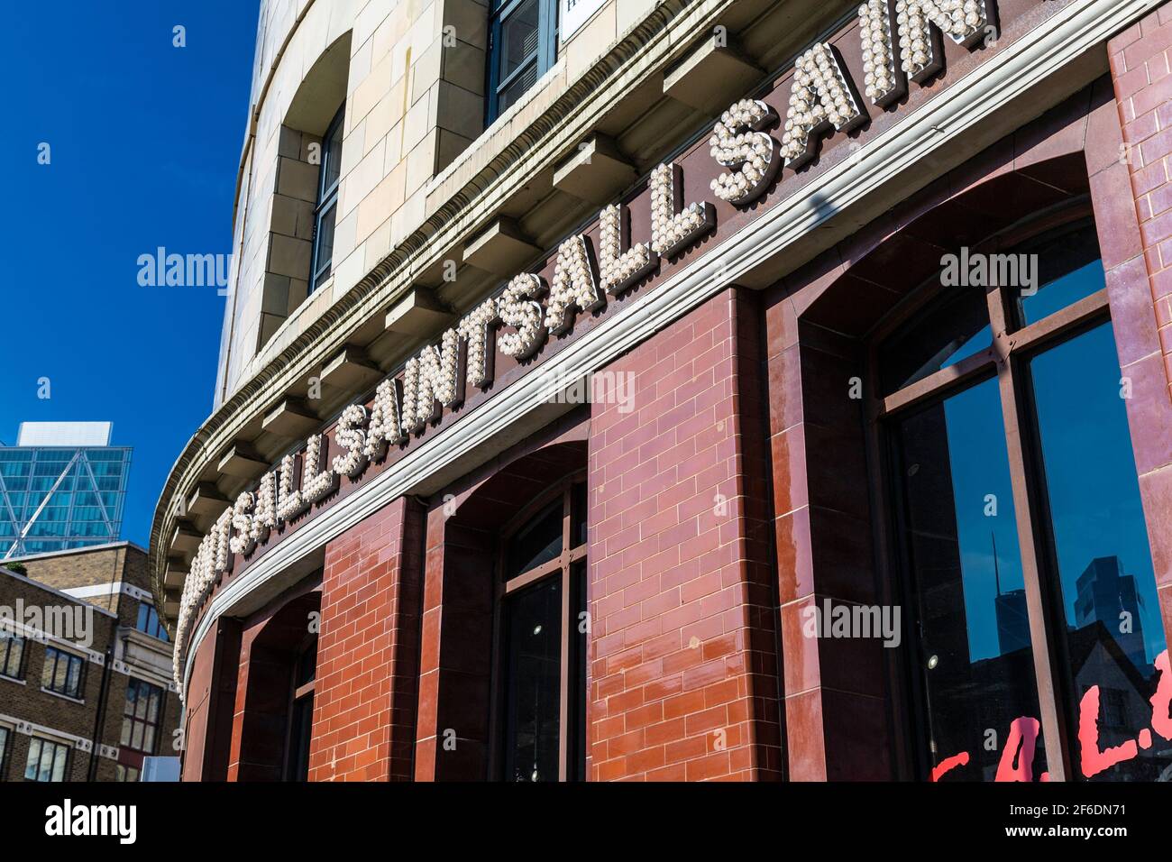 Shop exterior of AllSaints clothing brand with a lightbulb sign in Shoreditch, London, UK Stock Photo