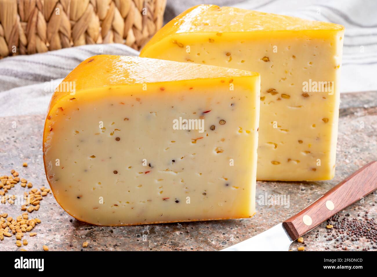 Cheese collection, pieces of hard yellow Dutch gouda cheese with dried