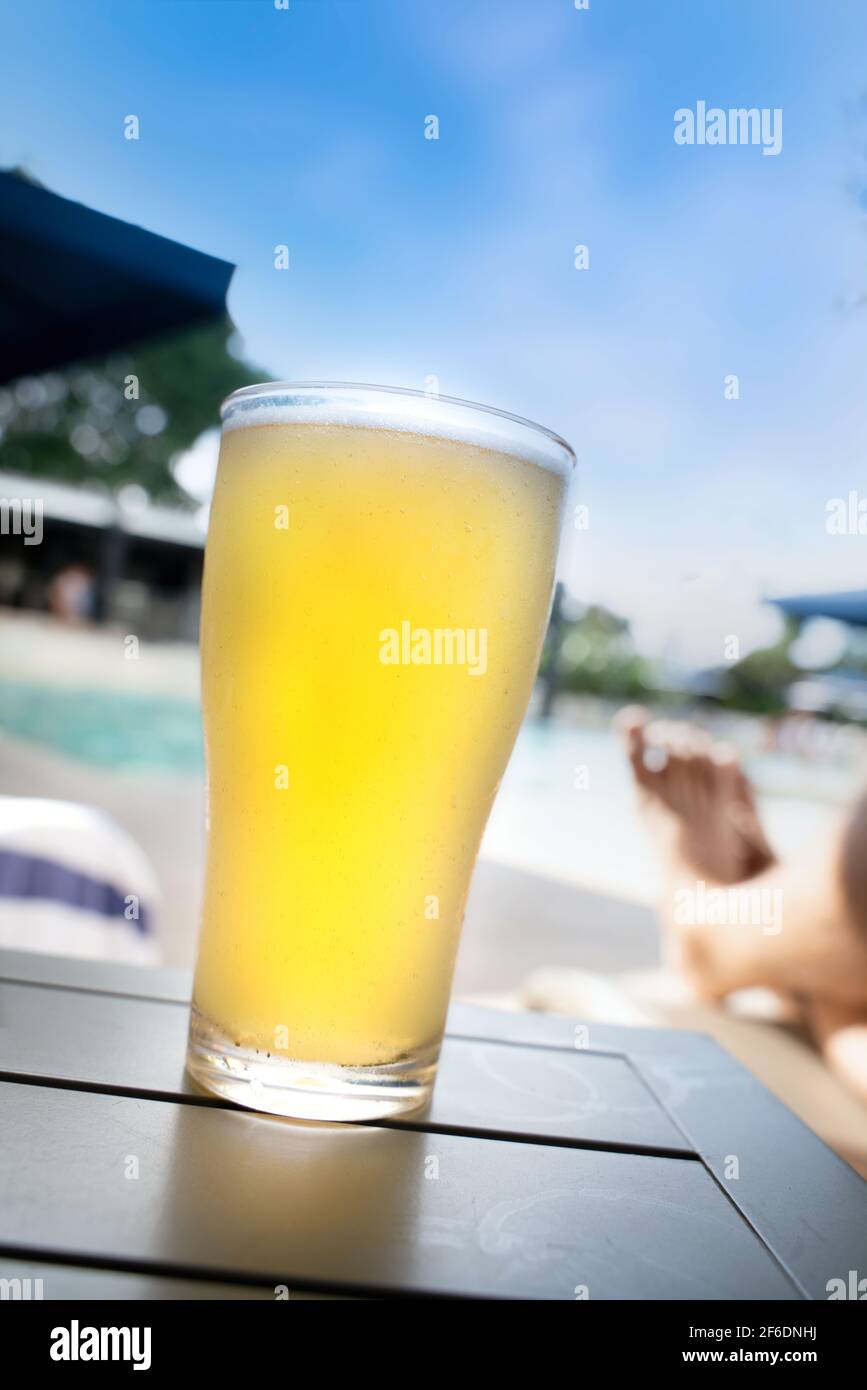 A cold beer near the pool Stock Photo Alamy