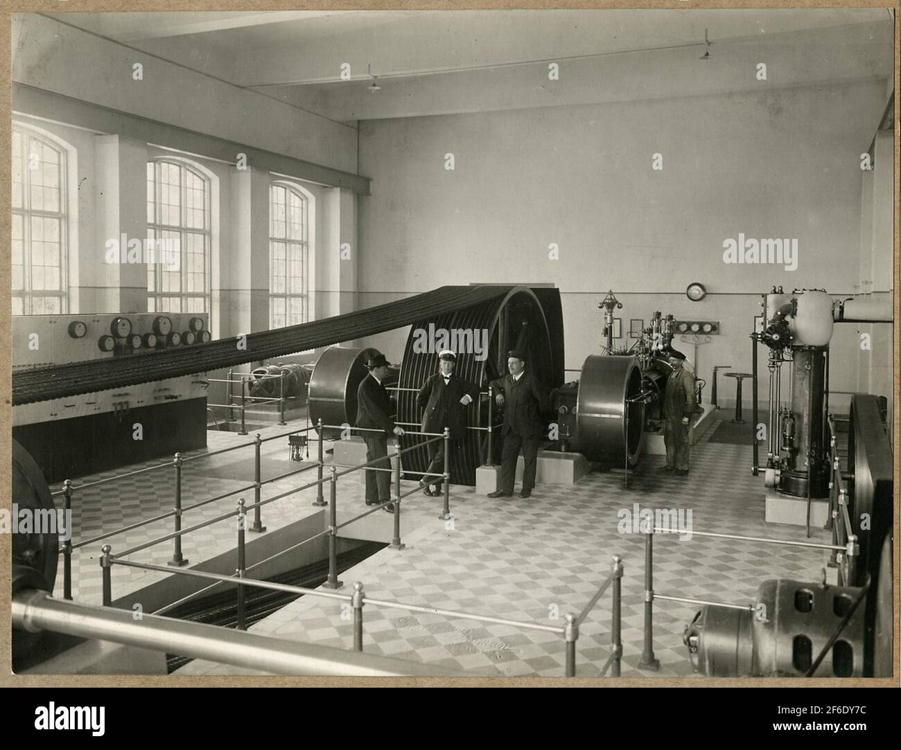 Machine hall with a steam engine where the power transmission takes ...