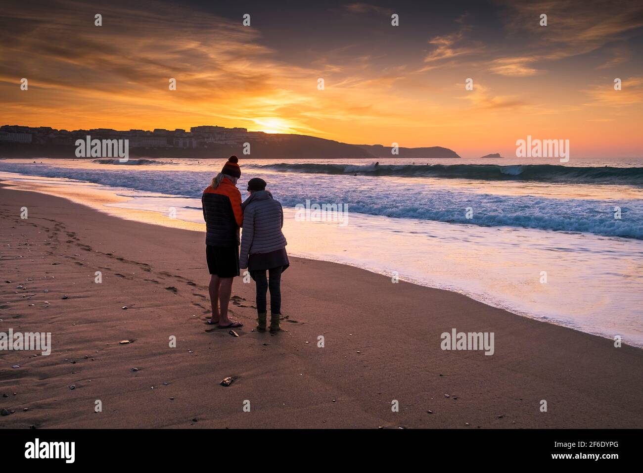 A golden sunset over Fistral Beach in Newquay in Cornwall. Stock Photo