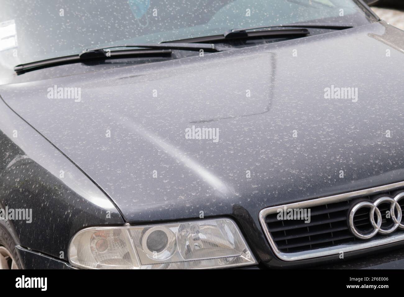 Mud rain or African dust rain effects with drops of dust on cars Stock Photo