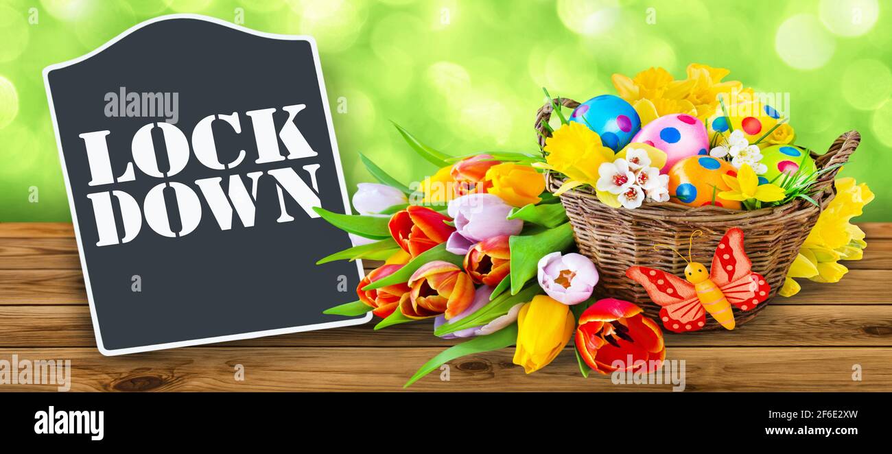 Lockdown and Easter decoration on wooden background Stock Photo