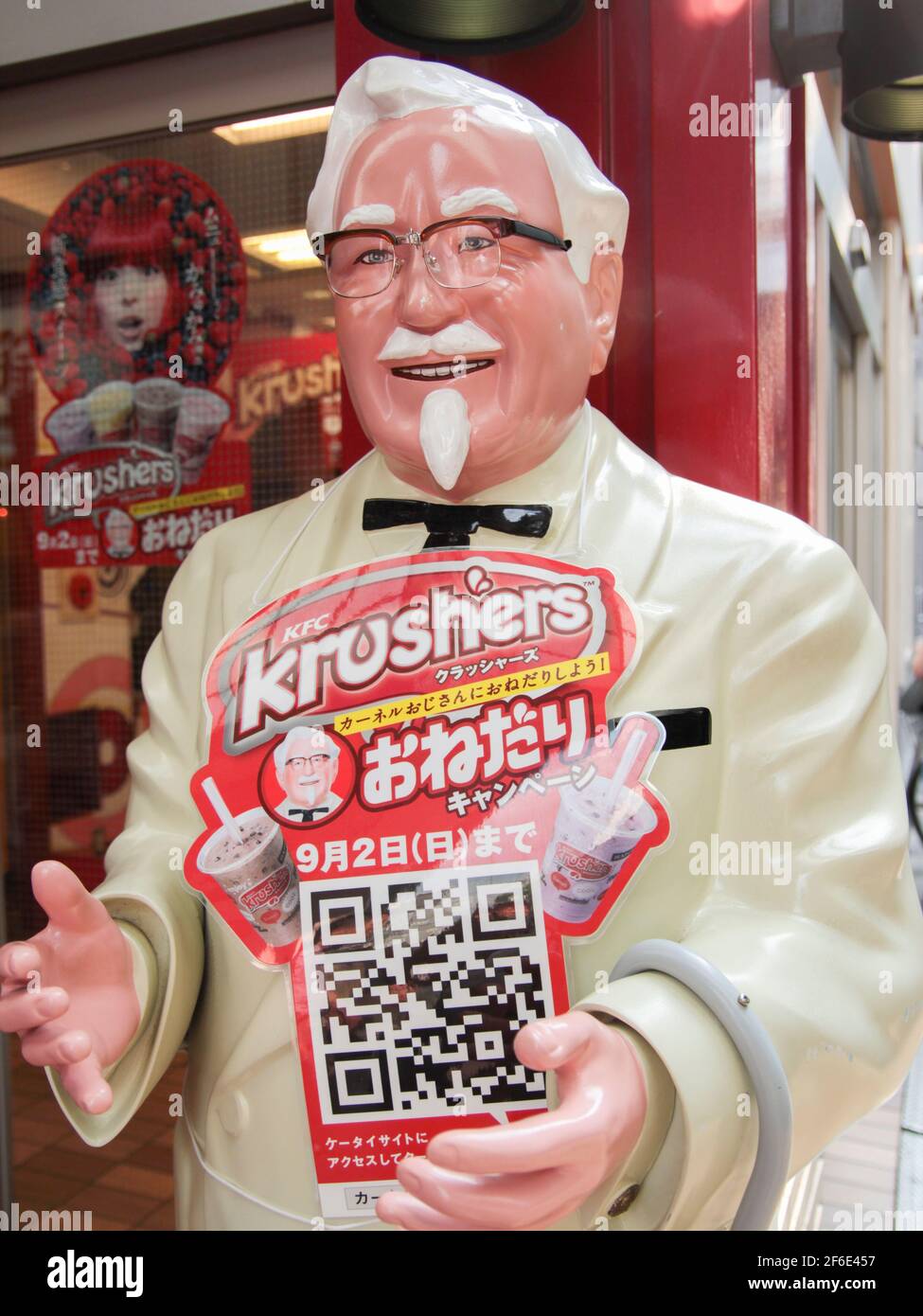 A plastic, fiberglass, life-size, statue, sculpture figure, image of Colonel Sanders, symbol of KFC, Kentucky Fried Chicken. In Kyoto, Japan. Stock Photo