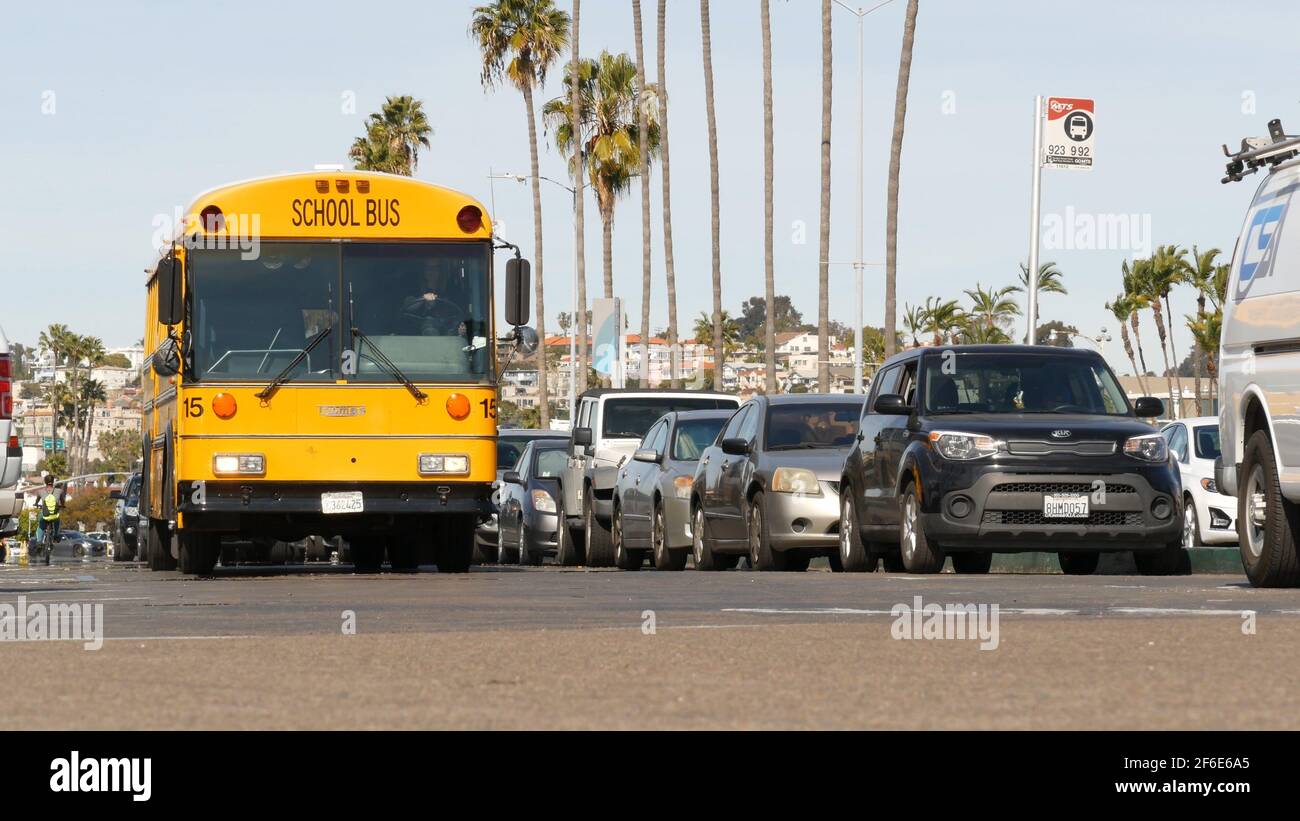 San Diego, California USA - 31 Jan 2020: American yellow school bus on street in downtown. Schoolbus shuttle on road, city near Los Angeles. Education Stock Photo