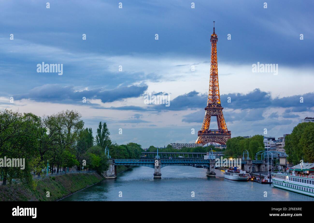 A picture of the Eiffel Tower's light show at sunset Stock Photo Alamy