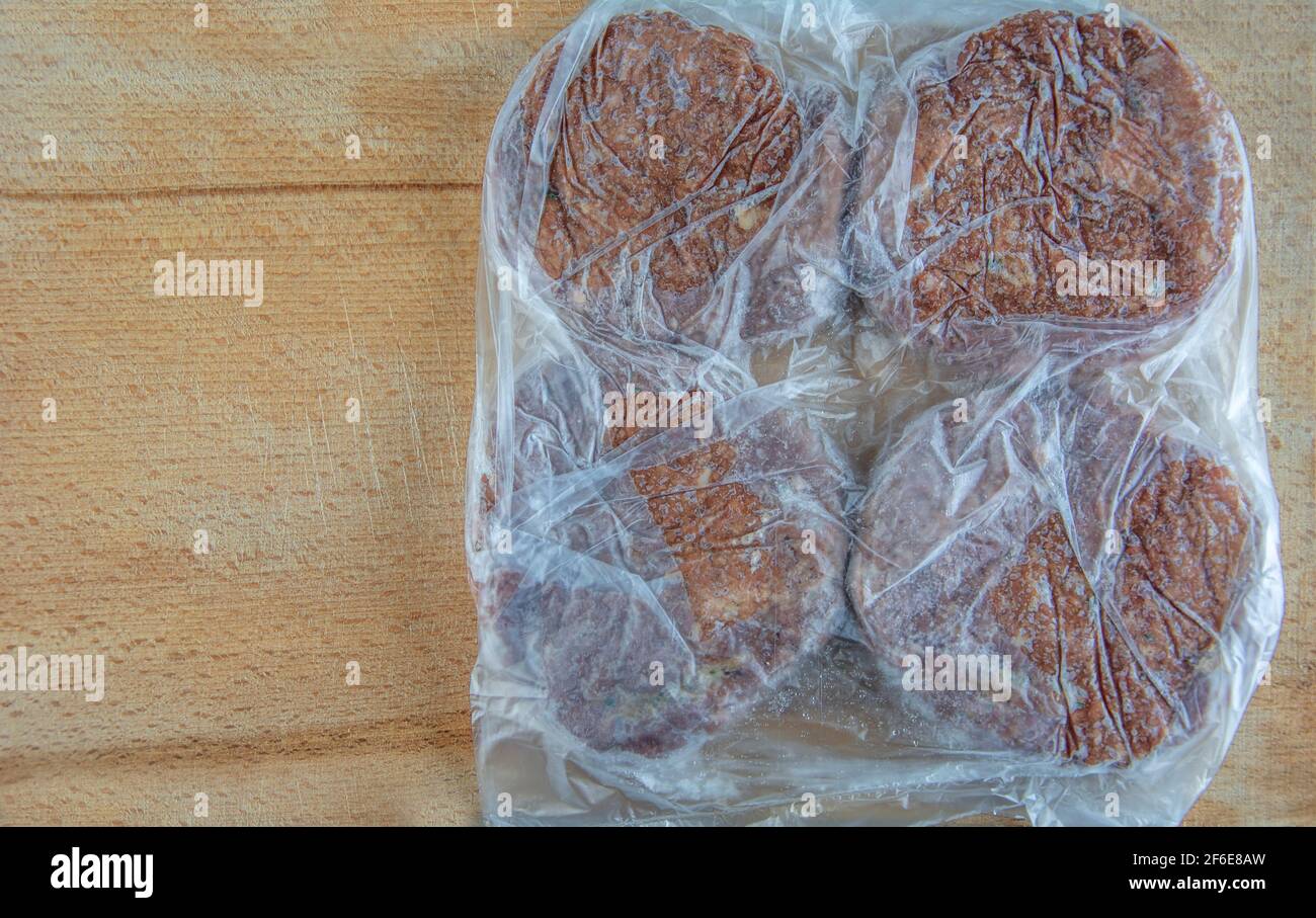 Meatballs in freezer bag on serving board in close-up Stock Photo