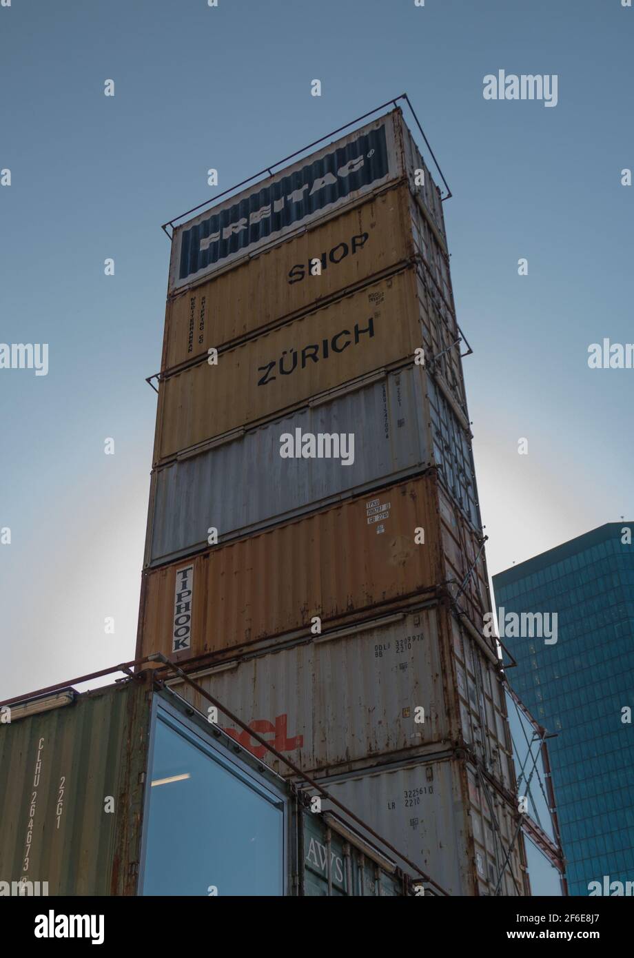 A picture of a stack of cargo containers in Zürich that actually decorate a  clothing store Stock Photo - Alamy
