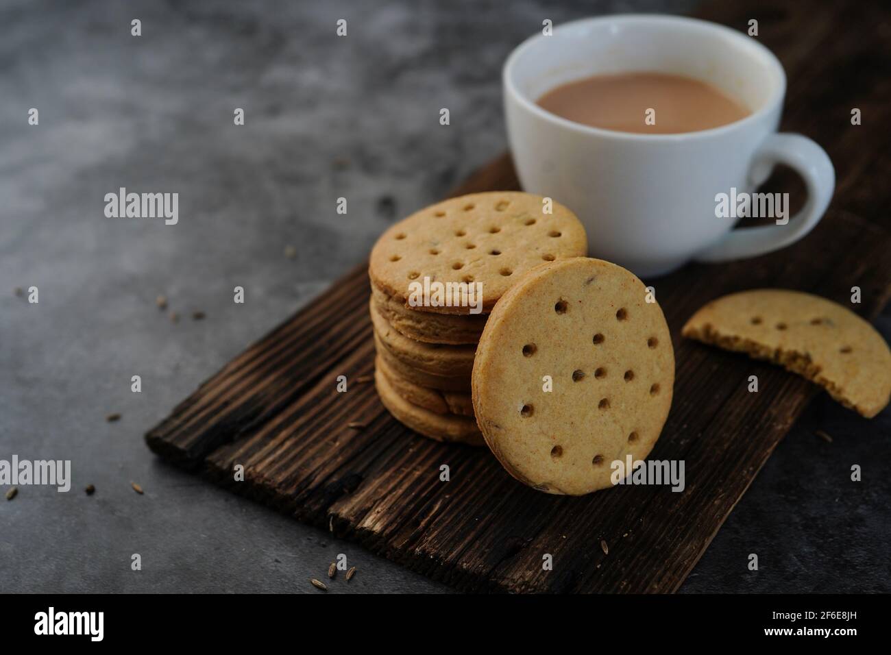 Homemade Indian Atta biscuits - Whole wheat Cumin cookies served with tea, selective focus Stock Photo