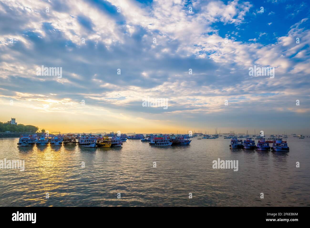 Tourist boats in sea on sunrise in Mumbai, India Stock Photo