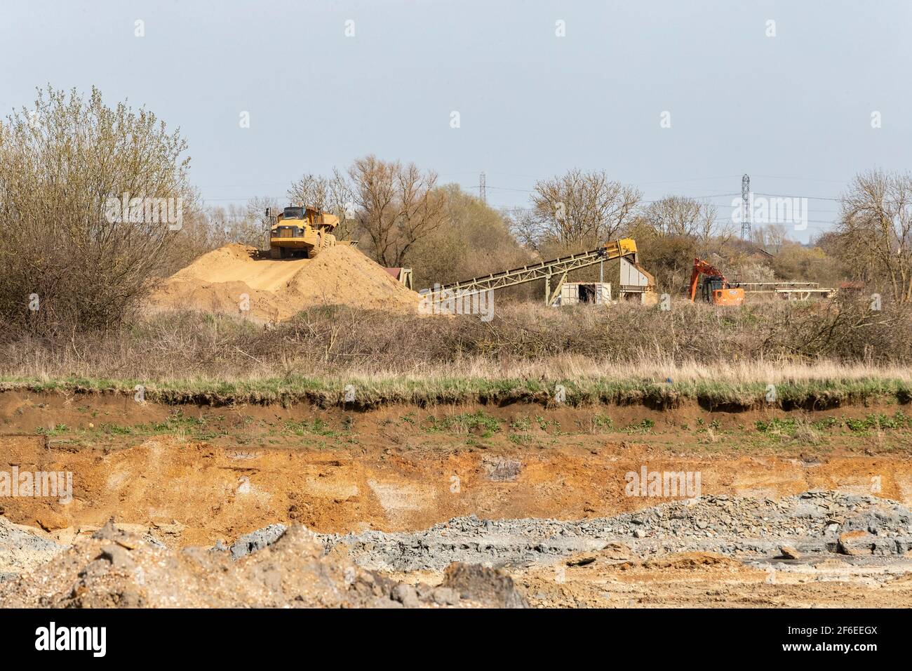 Cat 740B Articulated Truck working at Hanson Aggregates new quarry along the Nene Valley between Cogenhoe and Grendan Northamptonshire, Engalnd, UK. Stock Photo