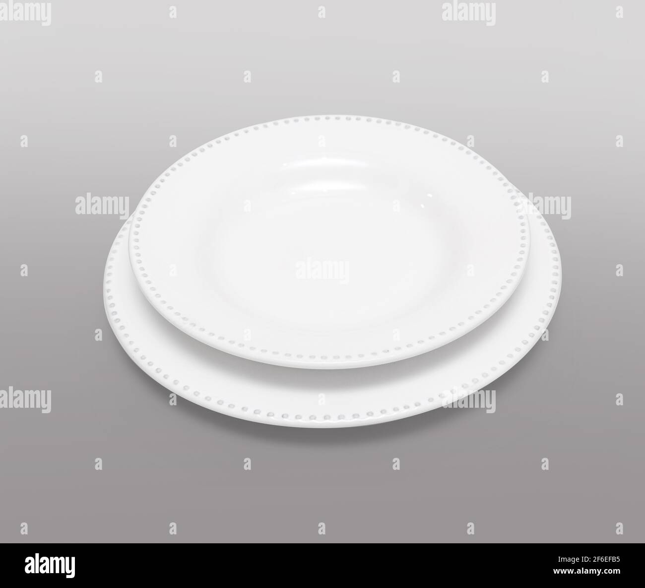 two white plate on gray background with clipping path Stock Photo