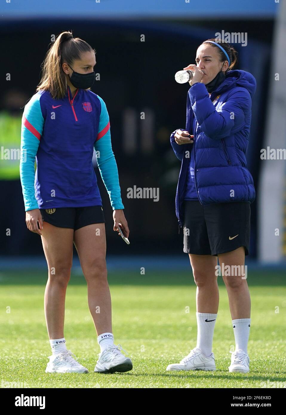 Barcelona's Lieke Martens (left) inspects the pitch before the 2021 UEFA Women's Champions League match at the Manchester City Academy Stadium, Manchester. Picture date: Wednesday March 31, 2021. Stock Photo
