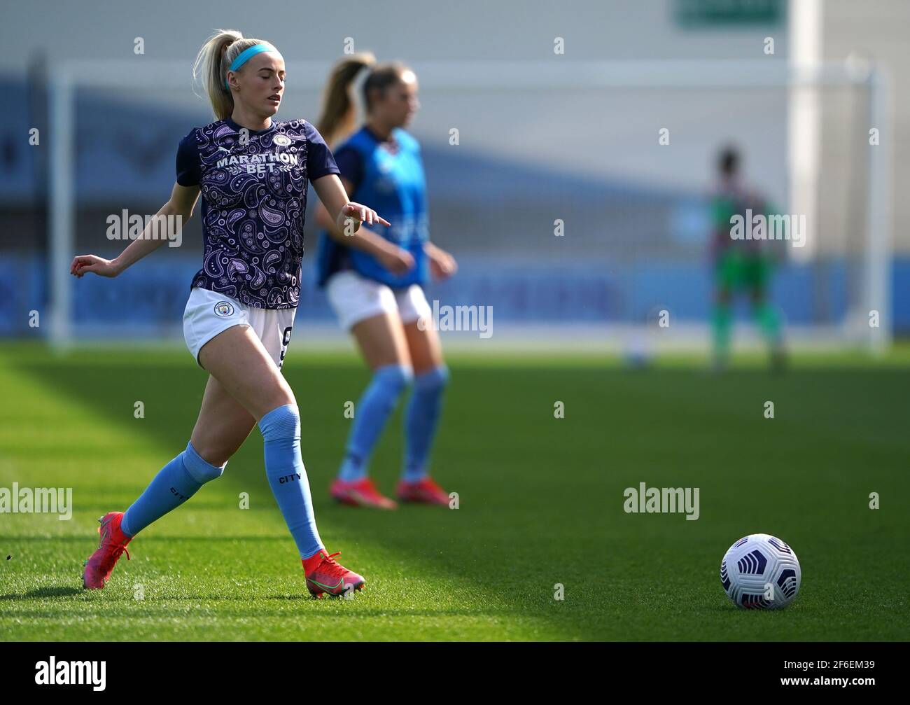 Manchester City's Chloe Kelly warming up before the 2021 UEFA Women's Champions League match at the Manchester City Academy Stadium, Manchester. Picture date: Wednesday March 31, 2021. Stock Photo