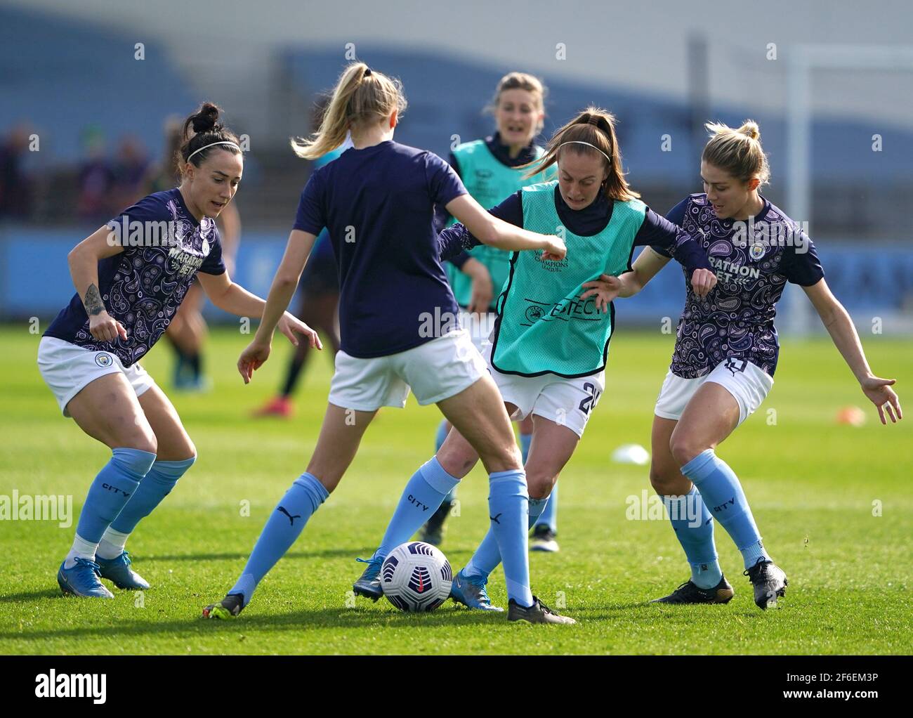 Manchester City's Keira Walsh (centre right) warming up before the 2021 UEFA Women's Champions League match at the Manchester City Academy Stadium, Manchester. Picture date: Wednesday March 31, 2021. Stock Photo