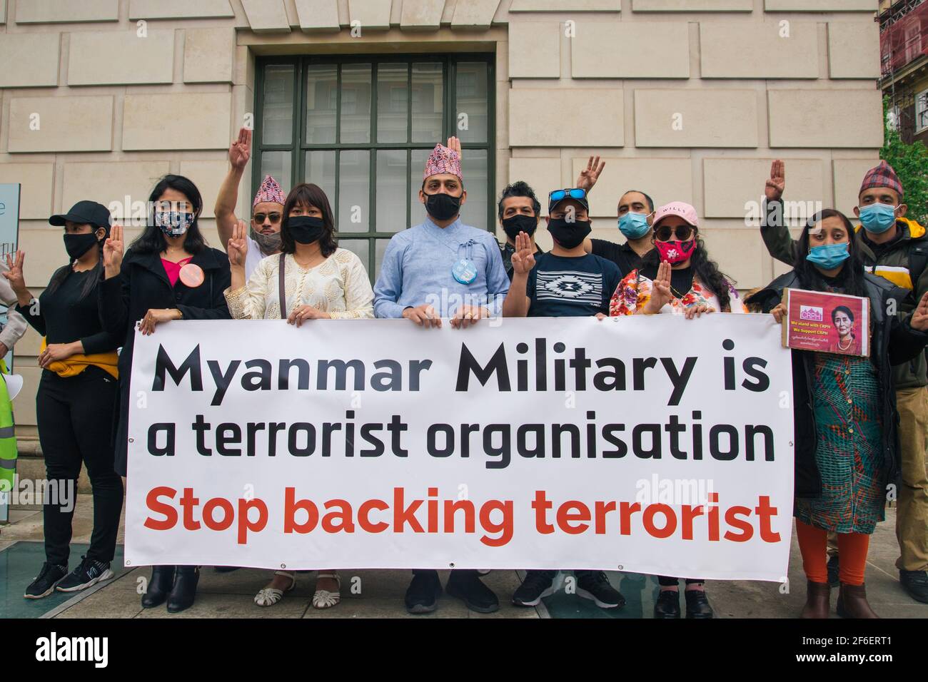 London, UK. 31st Mar 2021. Protest against military violence in Myanmar. Protestors gather in Parliament Square and march to the Chinese Embassy to voice their displeasure at Chinese involvement in the military coup and murder of innocent civilians including children Stock Photo
