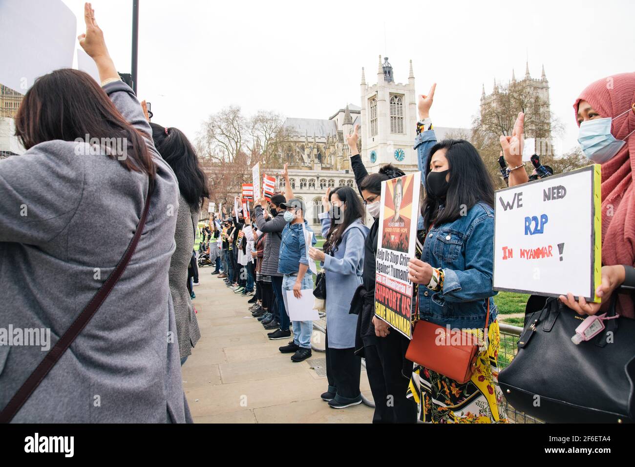 London, UK. 31st Mar 2021. Protest against military violence in Myanmar. Protestors gather in Parliament Square and march to the Chinese Embassy to voice their displeasure at Chinese involvement in the military coup and murder of innocent civilians including children Stock Photo