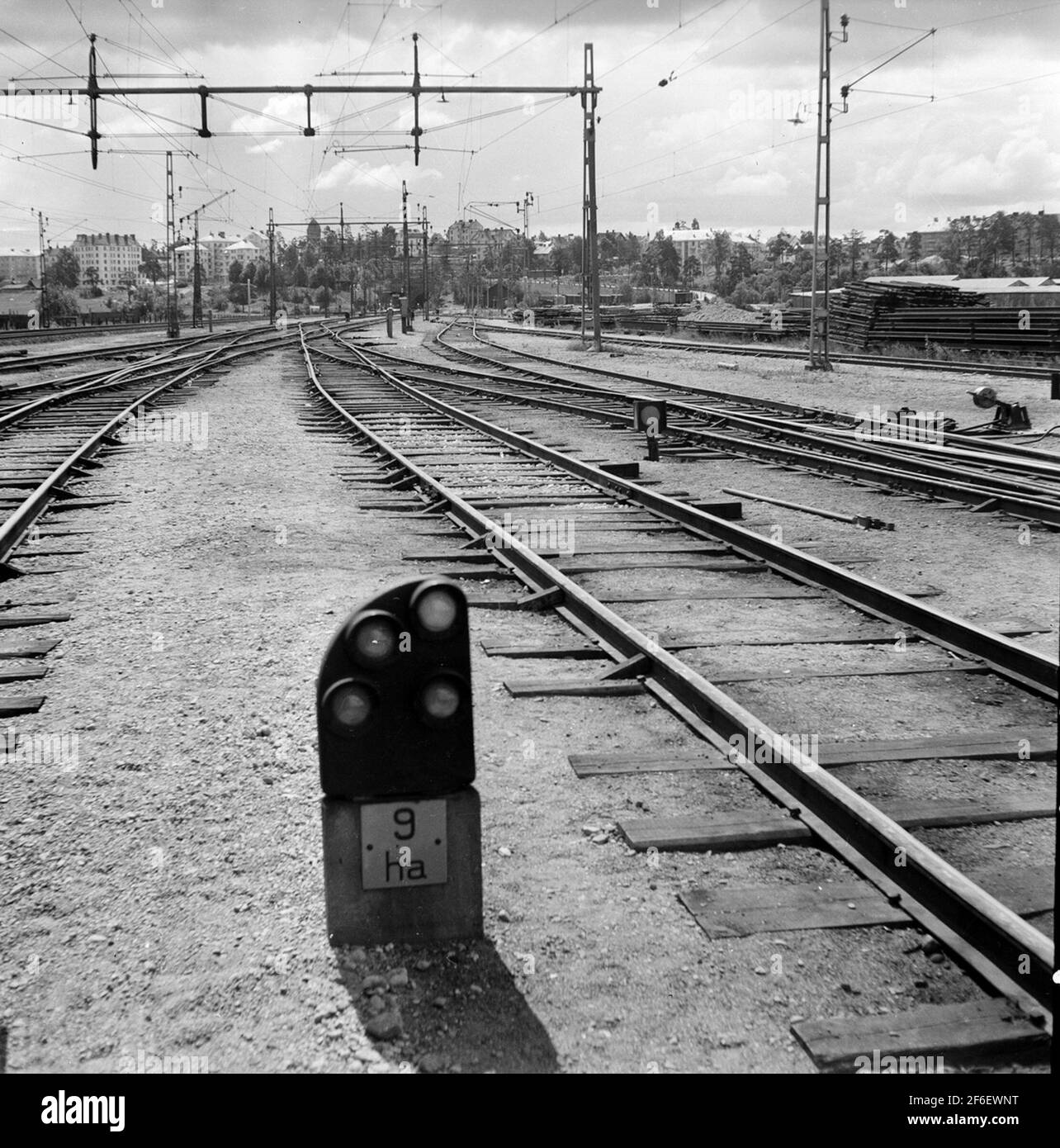 Harplinge railway with society in the background. In the foreground a dwarf signal. Stock Photo
