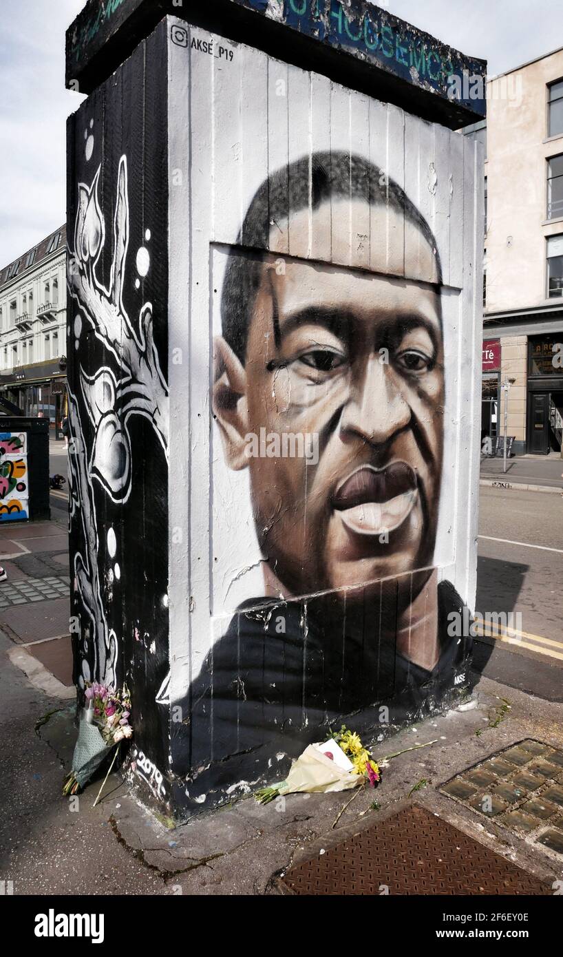 Manchester, UK. 31 March 2021. Flowers laid at a street art picture of George Floyd who died whilst being arrestedCredit: Julian Brown Stock Photo