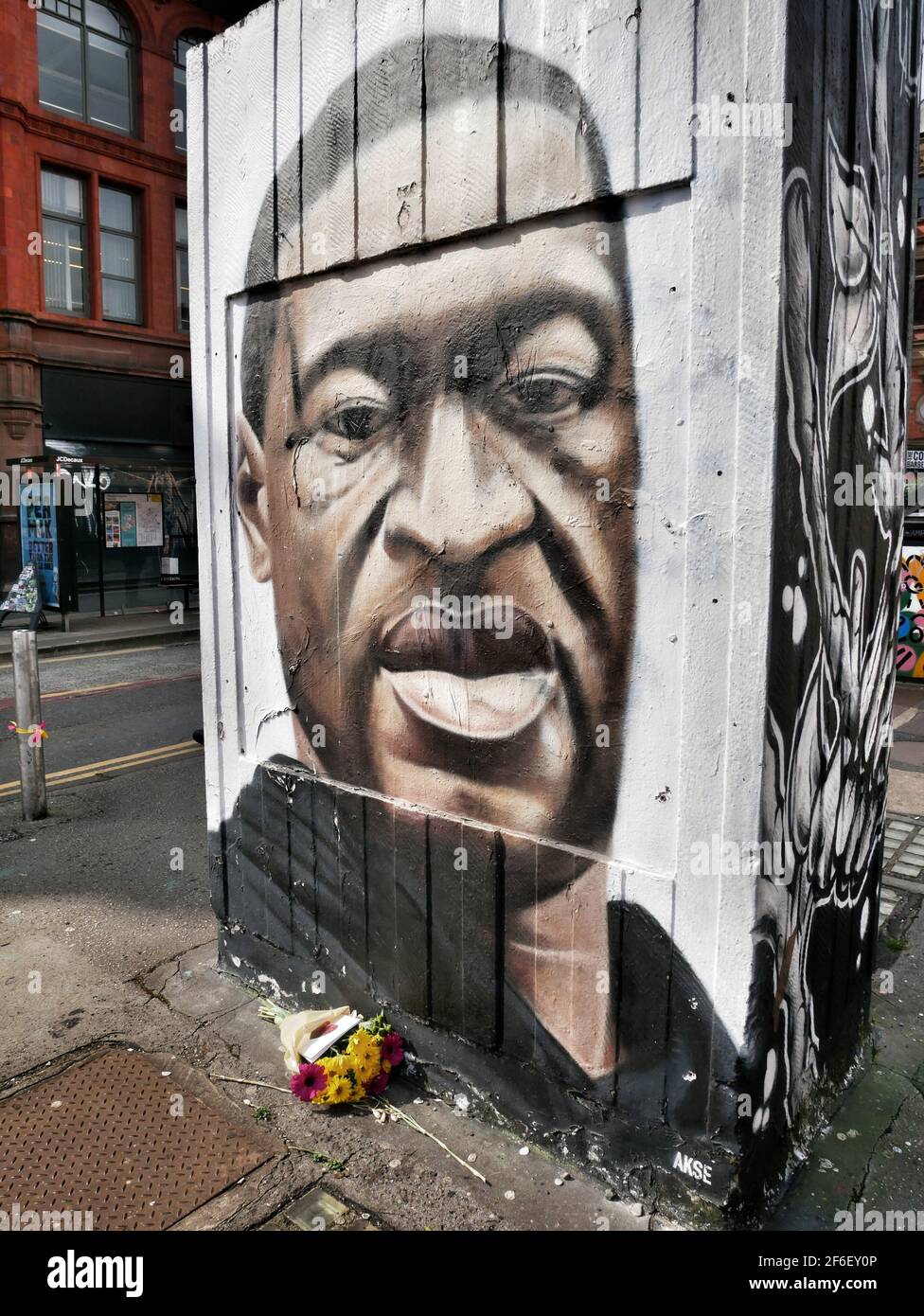 Manchester, UK. 31 March 2021. Flowers laid at a street art picture of George Floyd who died whilst being arrestedCredit: Julian Brown Stock Photo