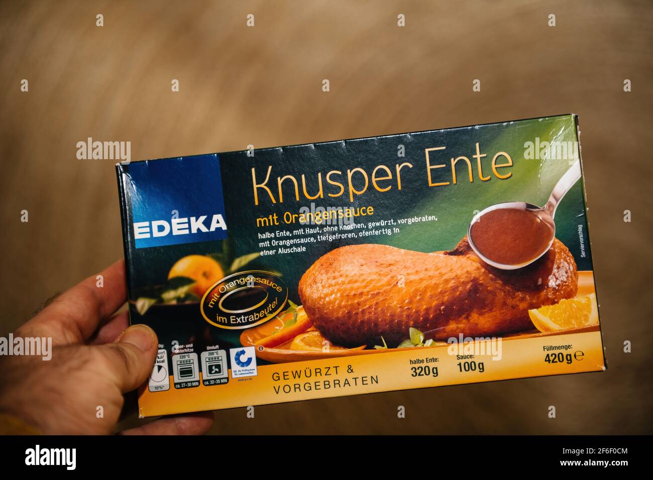 Male hand POV personal point of view at the Edeka Knusper Ente translated  as crispy duck frozen product Stock Photo - Alamy