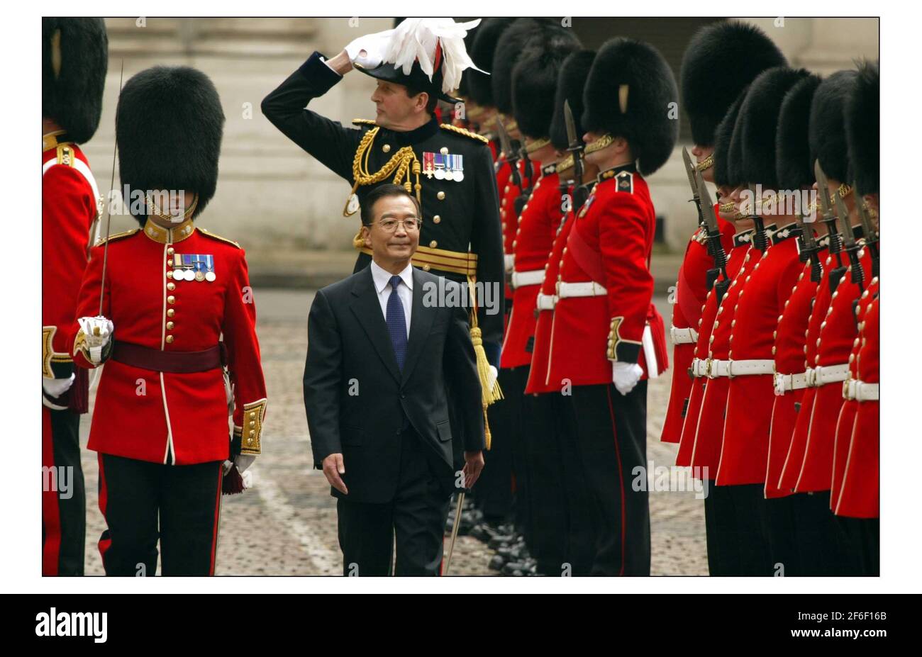 Tony Blair meets the Premier of the State Council of the Peoples Republic of China, H.E. Mr Wen Jiabao in the courtyard of the Foriegn Office to inspect the guard of Honour, The Queens co First Batalion Grenadier Guards.pic David Sandison 10/5/2004 Stock Photo