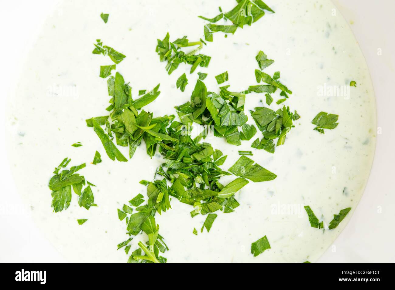Closeup of tartar sauce with fresh chopped herbs. Macro. Photo can be