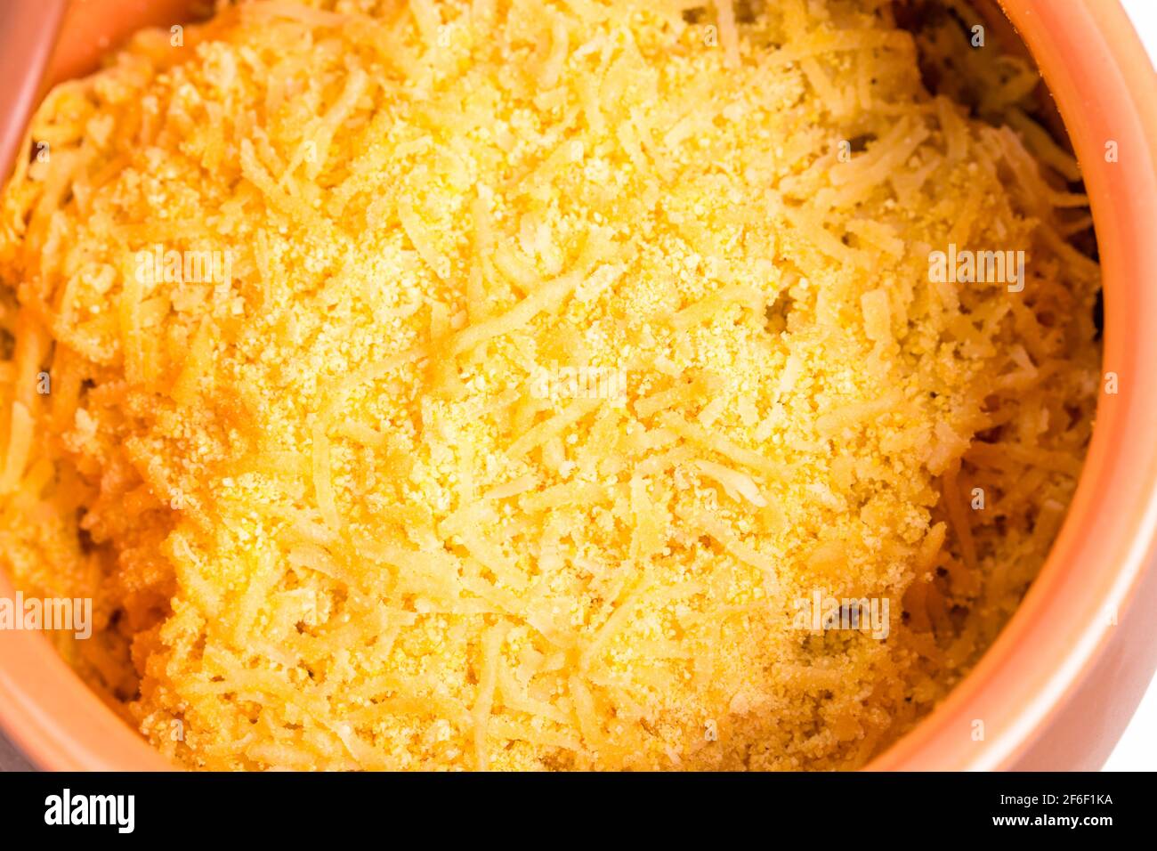 Delicious baked cow brains and testicles covered with grated cheese in