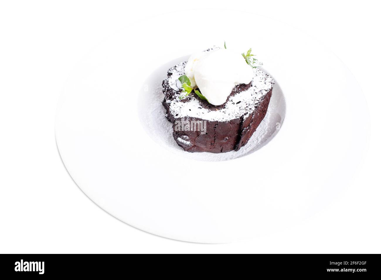 Chocolate brownie cake with vanilla ice cream on top and covered with ...
