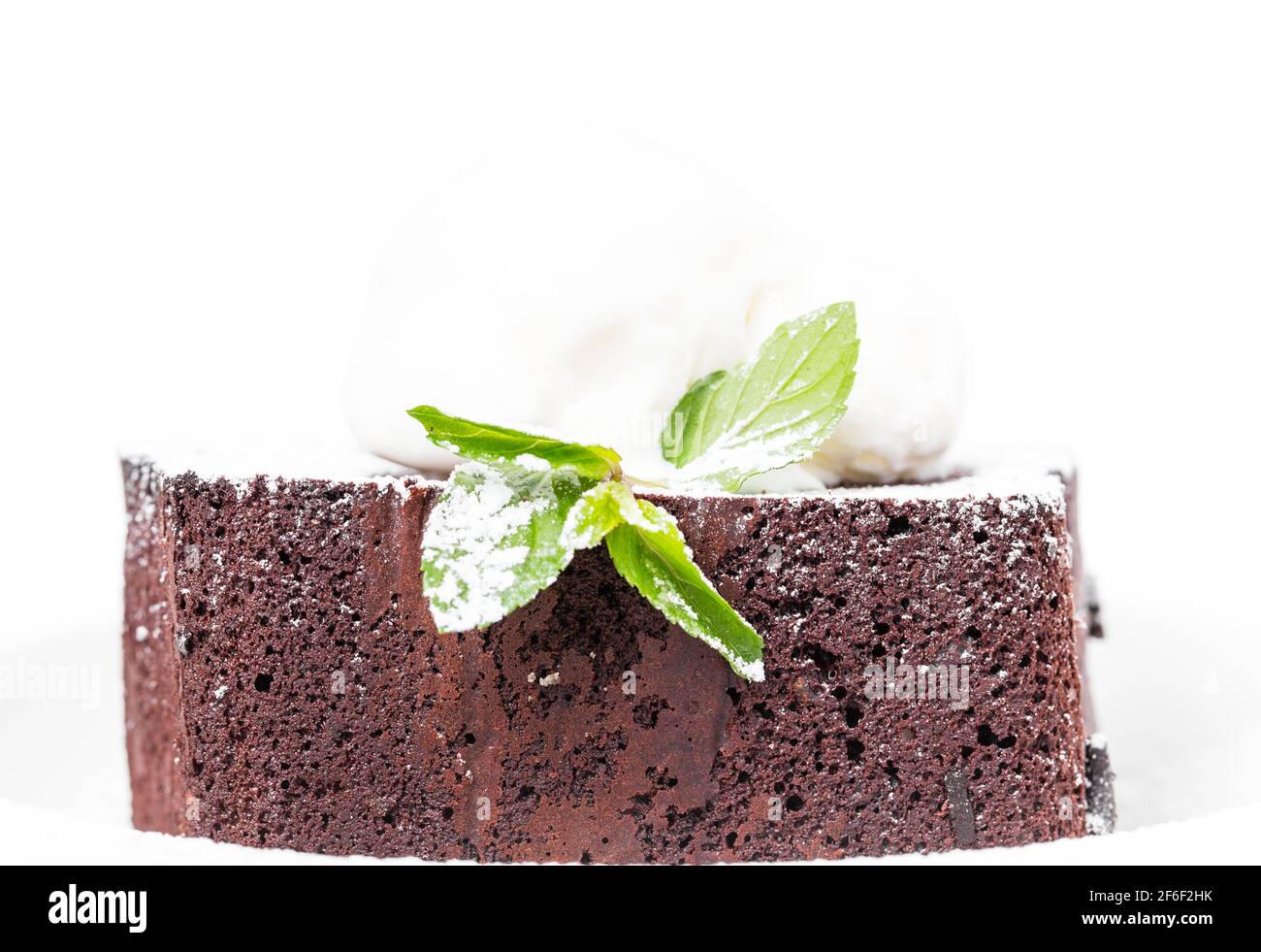 Chocolate brownie cake with vanilla ice cream on top and covered with ...