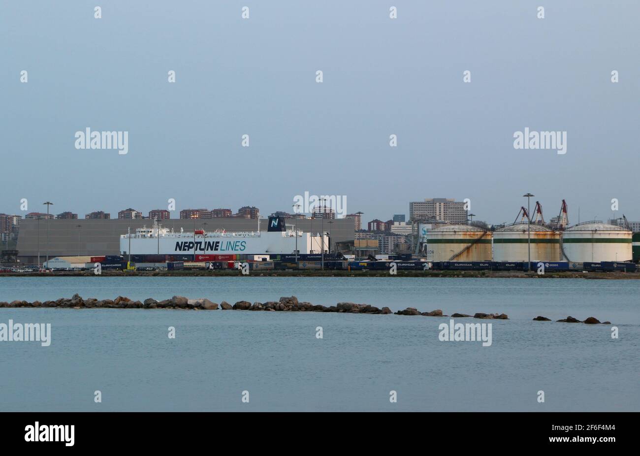 View across the bay of Santander Cantabria Spain with the port and the roro vehicles carrier cargo ship Neptune Dynamis in port and silos Stock Photo