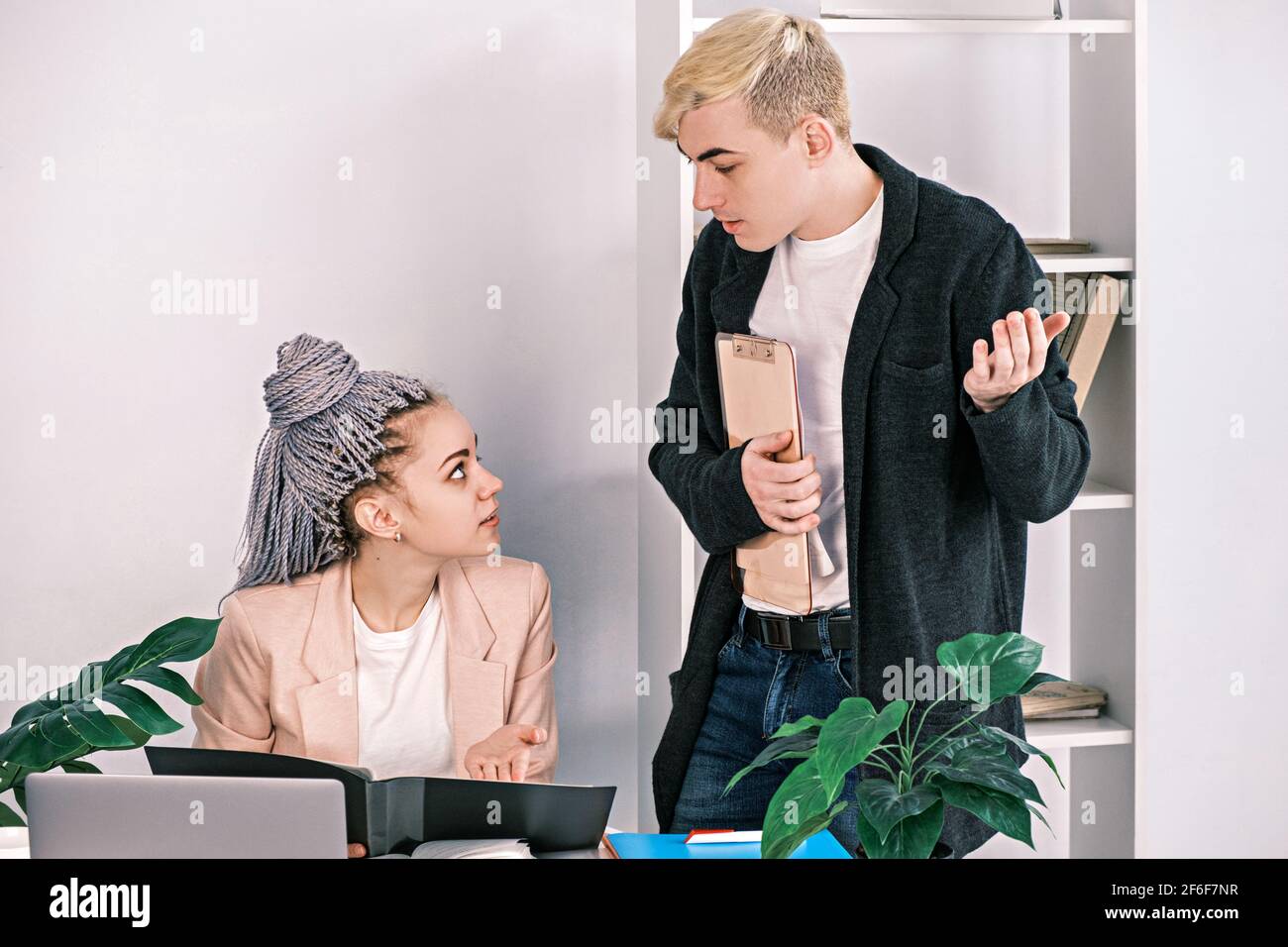 Male boss talking secretary hi-res stock photography and images - Alamy