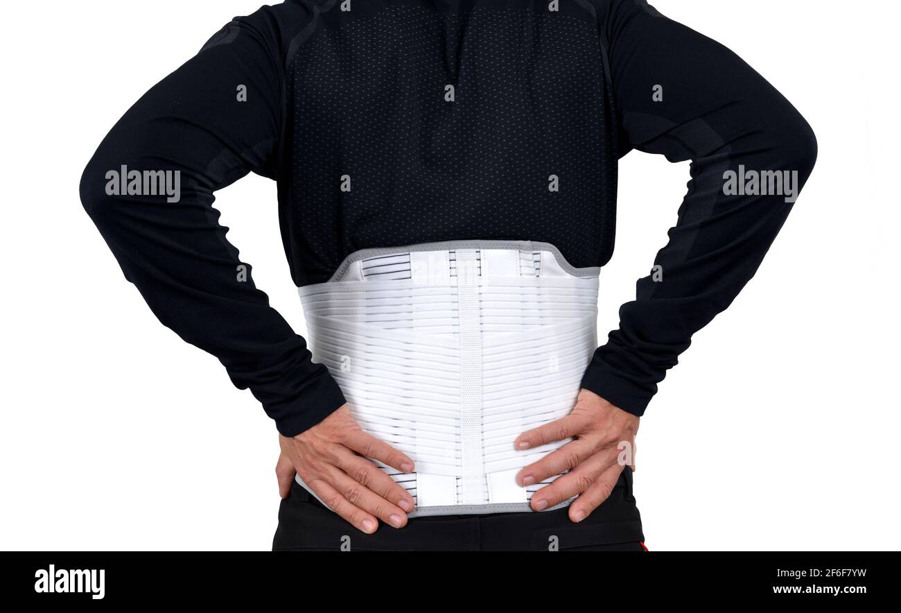 Man wearing back support belt isolated on white. Stock Photo