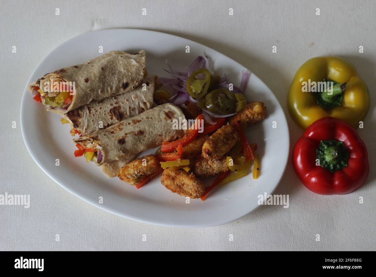 Paneer bell pepper rolls. Breaded and air fried cottage cheese, sauteed