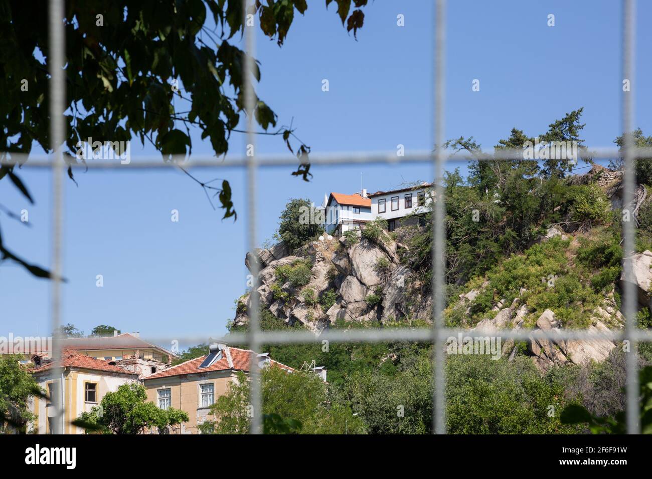 Looking up at a cliff-top building in Plovdiv Old Town, Bulgaria Stock Photo