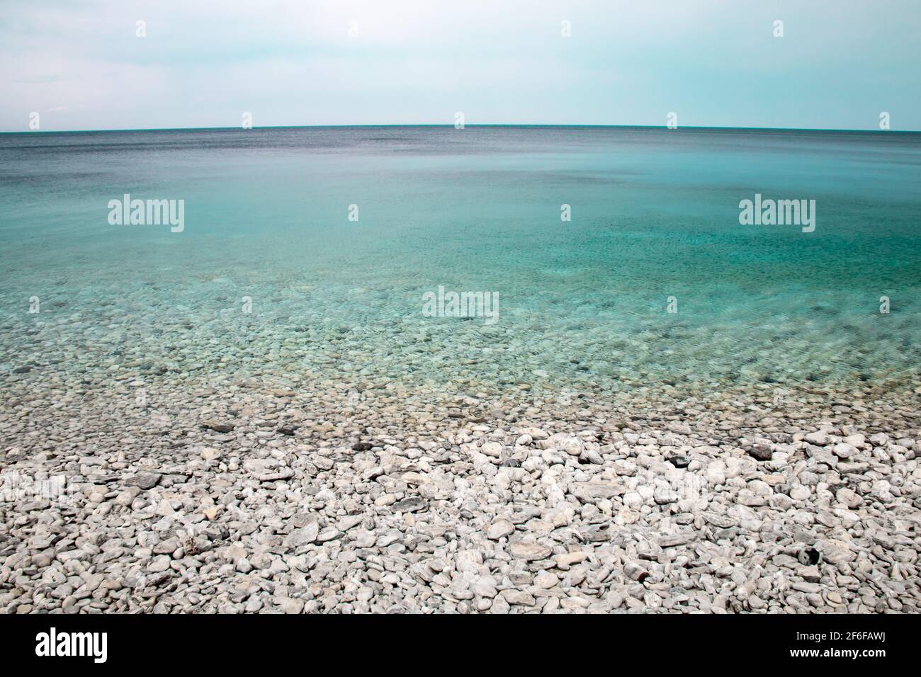 White pebbles and turquoise water at Halfway Log Dump, Bruce Peninsula National Park, Ontario, Canada. Stock Photo