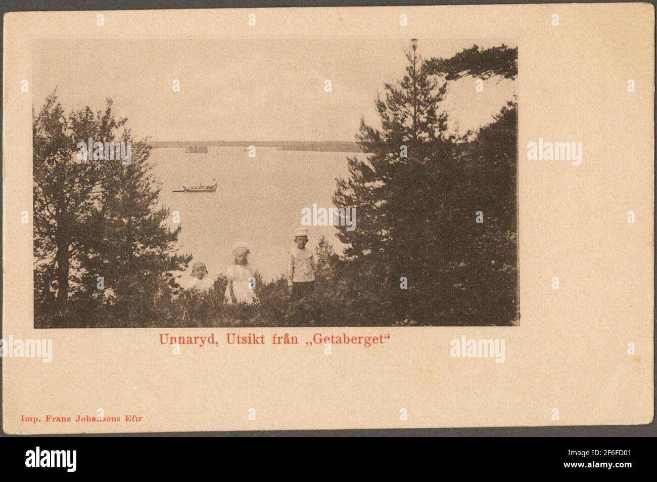 Children on mountains overlooking Lake Unnen. Stock Photo