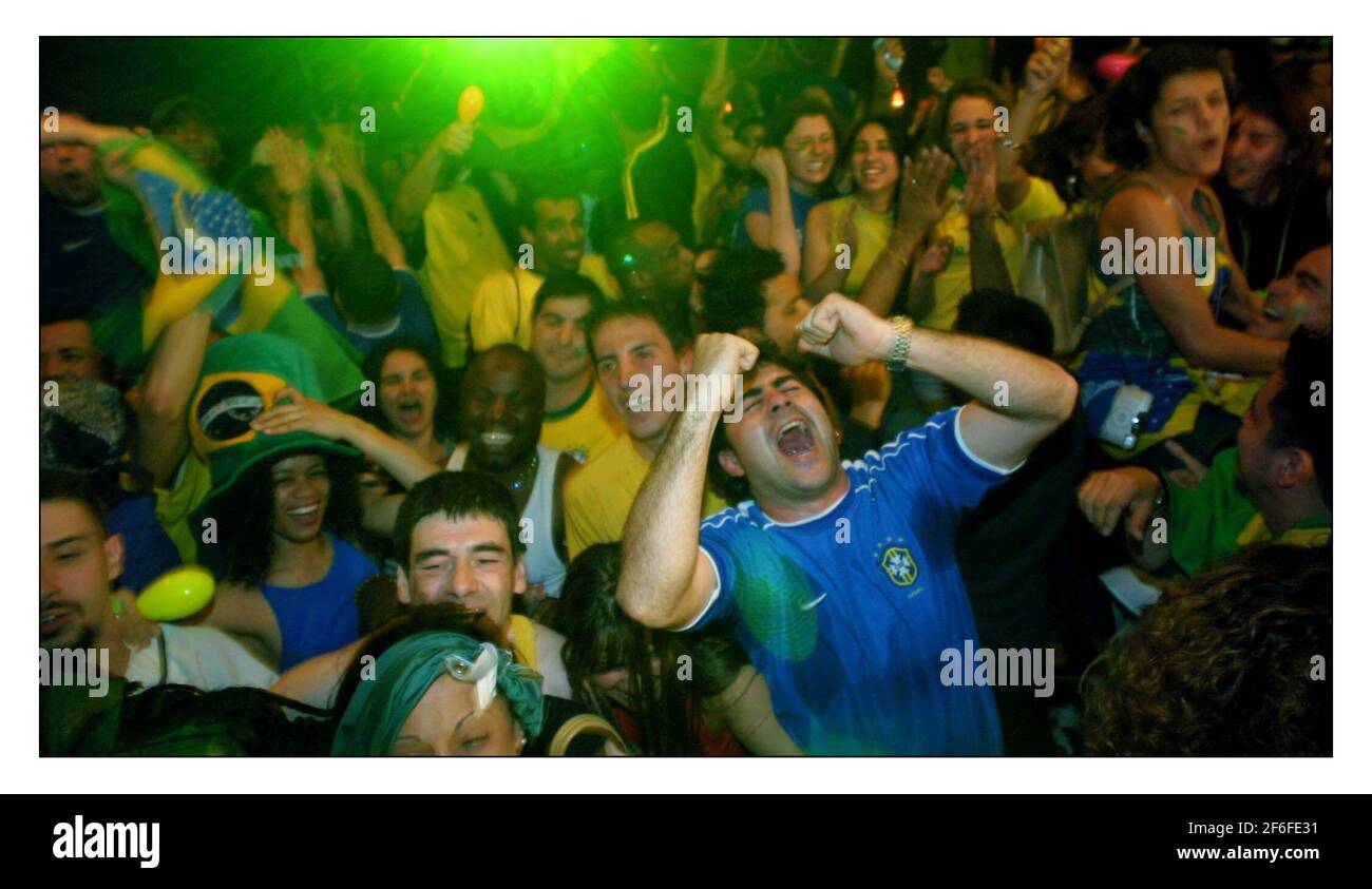Brazil fans in Salsa Bar in London celebrate their win over England in