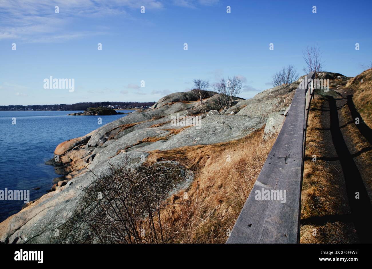 Take a path to go up the hill to see the ocean Stock Photo