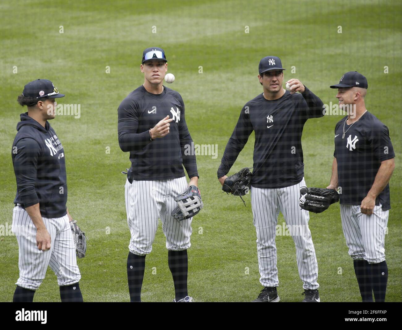 Bronx, United States. 31st Mar, 2021. New York Yankees Giancarlo Stanton, Aaron Judge, Mike Tauchman and Brett Gardner warm up on the field one day before their 2021 MLB Opening Day game against the Toronto Blue Jays at Yankee Stadium on Wednesday March 31, 2021 in New York City. Due to the ongoing coronavirus pandemic, the attendance for the Yankees' Opening Day meeting with the Toronto Blue Jays will be around 10,000 people. Photo by John Angelillo/UPI Credit: UPI/Alamy Live News Stock Photo