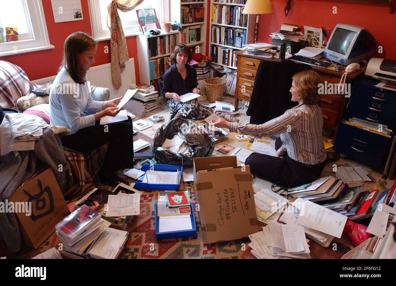 Suzanna Wilson (left) and Emma Chapman (right), Account Managers from the company Hire Intelligence, at the home of Carolyn Hart(centre).20 May 2002 photo Andy Paradise Stock Photo