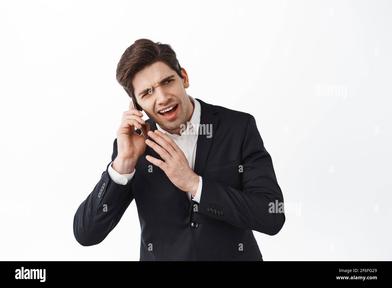 business-man-cant-hear-person-on-the-phone-having-a-call-crowded-loud