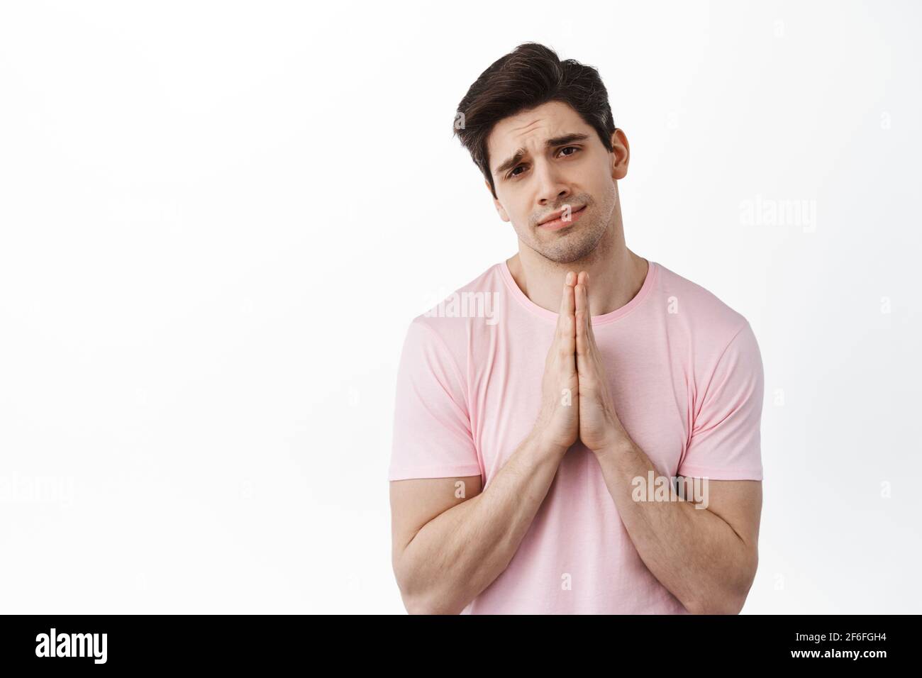 Please I beg you. Sad desperate man asking for help, begging, holding