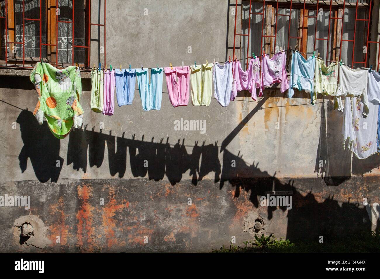 Drying clothes hanging outside the window of an old facade.İstanbul,Turkey Stock Photo