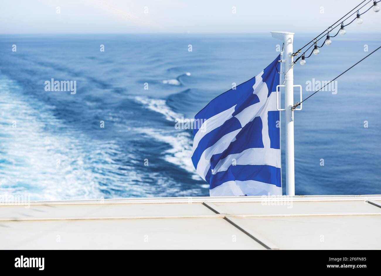 Greek flag. Travelling by ferry among Cyclades islands, Greece Stock Photo