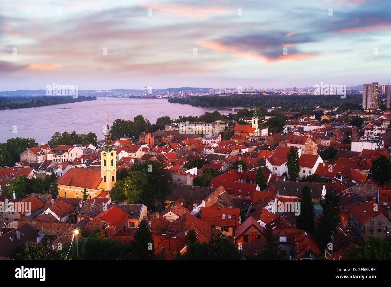 Beautiful sunset above the Danube river and rooftops in the city, Zemun, Belgrade, Serbia Stock Photo